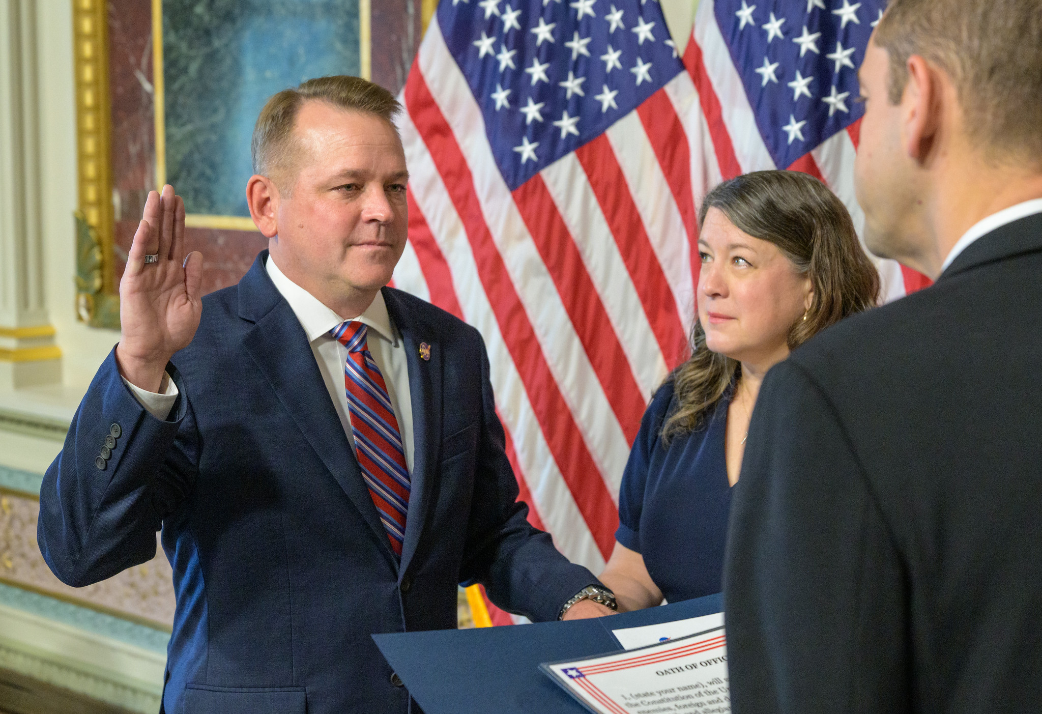 Matt Anderson, left, joined by his wife Christine, is sworn in as the 16th deputy administrator of NASA, by NASA Administrator Jared Isaacman, Thursday, May 21, 2026, at the Eisenhower Executive Office Building in Washington.