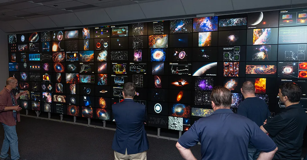 Photo of the fourth-generation hyperwall cluster installed at the NAS facility. The 128-screen hyperwall visualization system can display unique images in selected "cells", as seen here, or can display a single image across all screens.