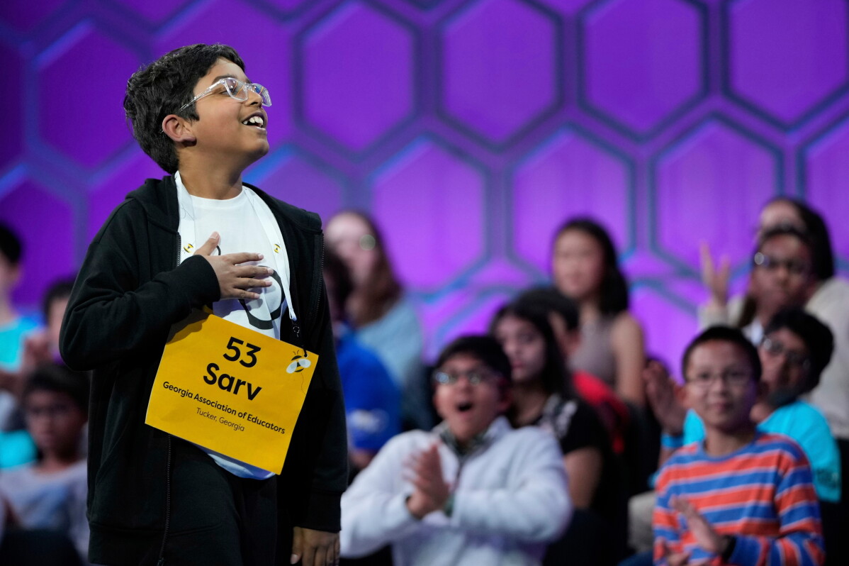 Sarv Dharavane, 11, of Tucker, Ga., reacts after spelling his word correctly in the finals of the Scripps National Spelling Bee, Thursday, May 29, 2025, in Oxon Hill, Md. (AP Photo/Julia Demaree Nikhinson, File)