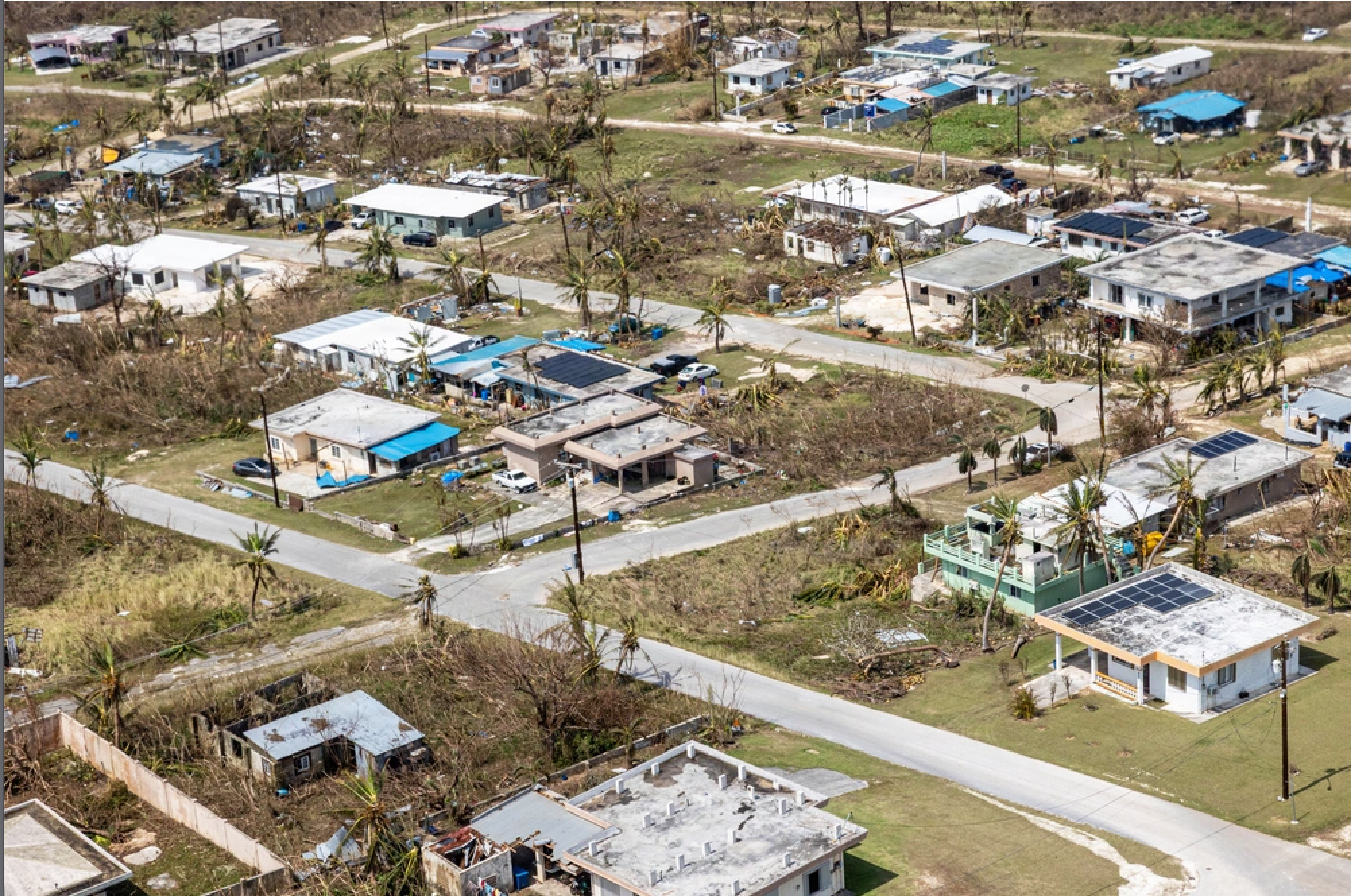 This photo provided by U.S. Marine Corps, debris covers homes and streets following Super Typhoon Sinlaku on the island of Saipan, April 18, 2026. Image by Avery Wayland/U.S. Marine Corps via AP.