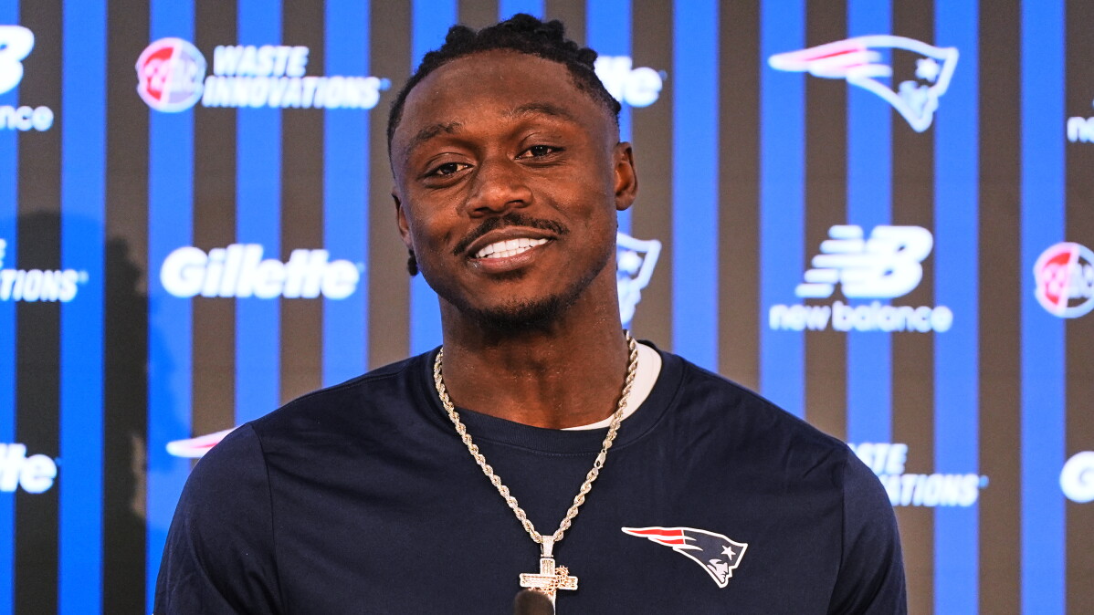 New England Patriots wide receiver A.J. Brown smiles during a media availability following an NFL football practice, Tuesday, June 2, 2026, in Foxborough, Mass. (AP Photo/Charles Krupa)
