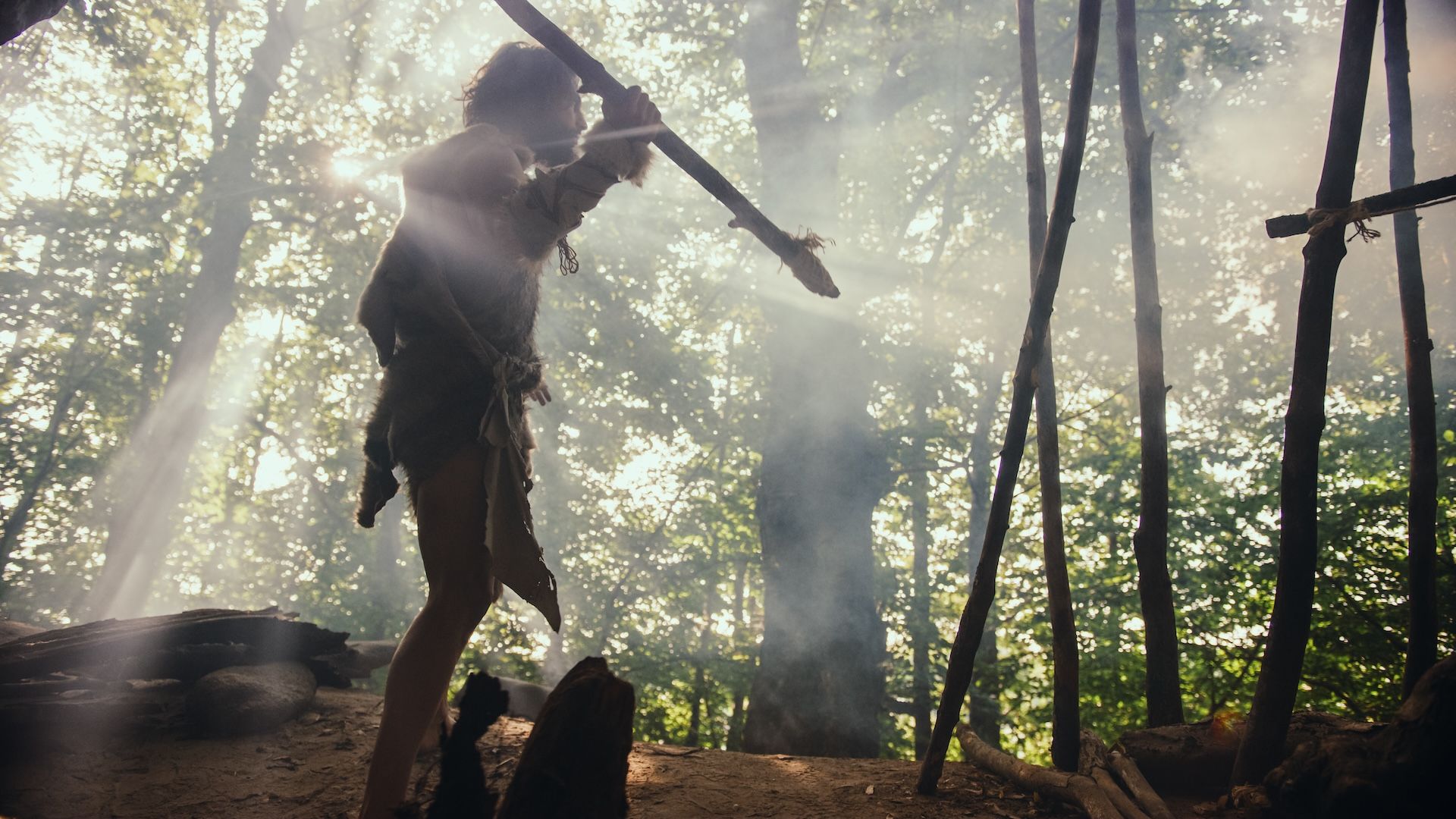 a recreation of a Neanderthal hunting in the forest