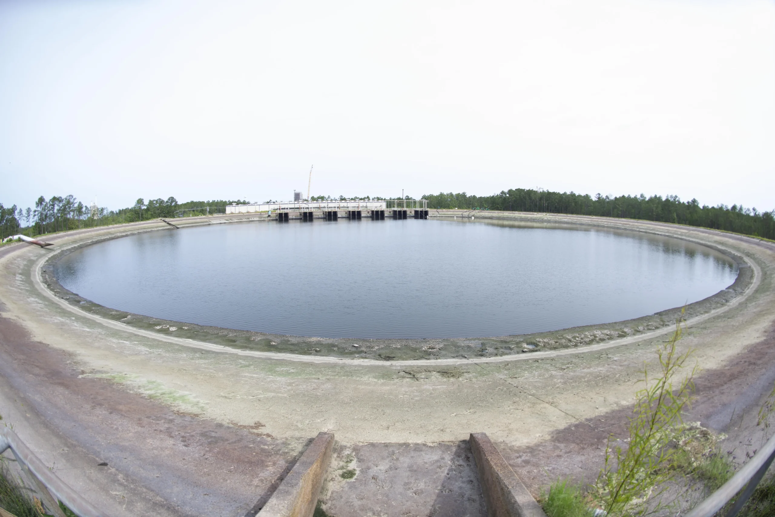 The reservoir at Stennis Space Center on May 11 shown at a dramatically lowered level, exposing large areas of the reservoir floor after 40 million gallons were pumped out.
