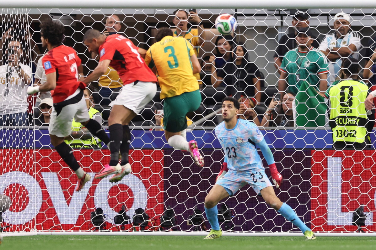Egypt goalkeeper Mostafa Shoubir (23) looks at the ball as Egypt's Mohamed Hany, left, scores an own goal during the World Cup round of 32 soccer match between Australia and Egypt in Arlington, Texas, near Dallas, Friday, July 3, 2026. (AP Photo/Sam Hodde)