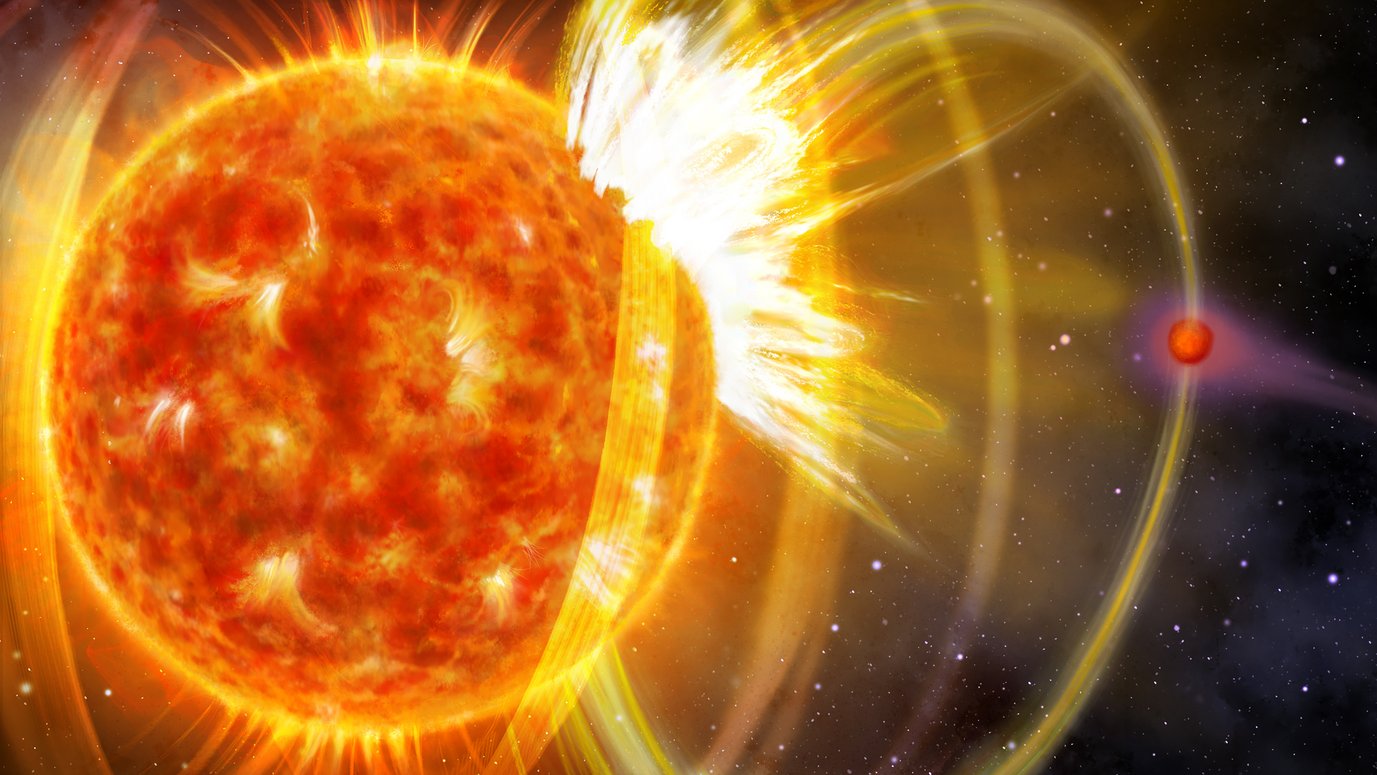 Flare erupting from the surface of a star with magnetic field lines visible.