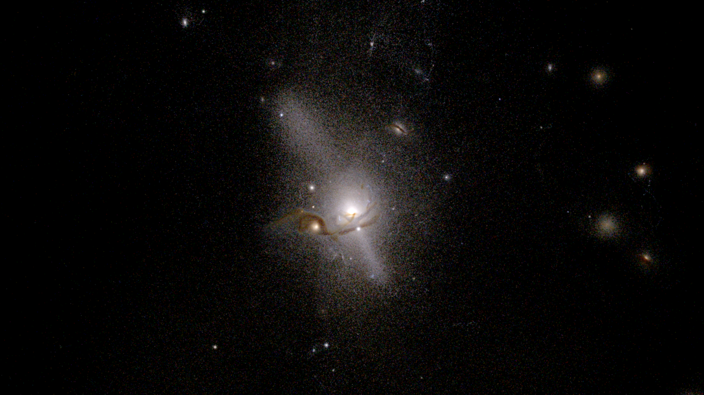 A glowing circular galaxy in deep space.